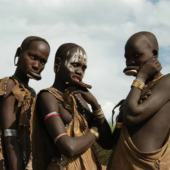 Mursi tribe women with traditional clay lip plates, Omo Valley, Ethiopia
